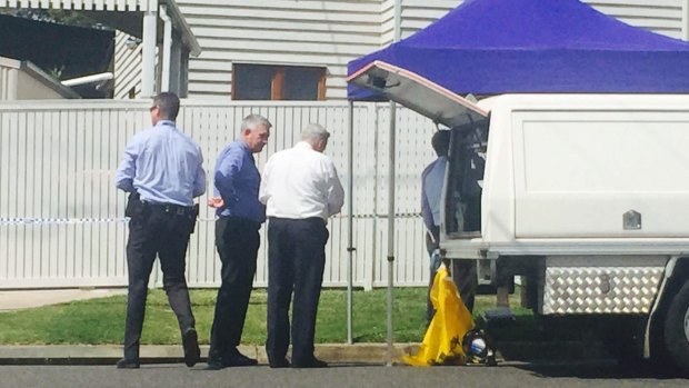 Police at the Kedron home where Sidney Playford was found dead in her bed by her mother.