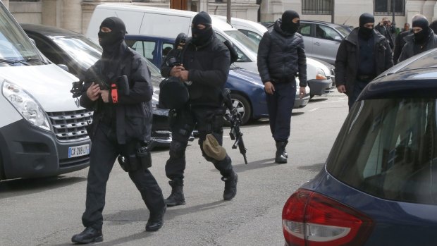 Police officers at the Palace of Justice complex in Paris on Wednesday.