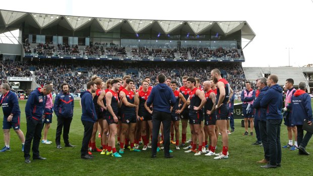 Paul Roos addresses his players for the final time during a match.
