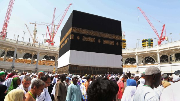 Muslim pilgrims walk around the Kaaba, the cubic building at the Grand Mosque in Mecca, Saudi Arabia, on September 12 when a crane collapsed, killing more than 100 people.