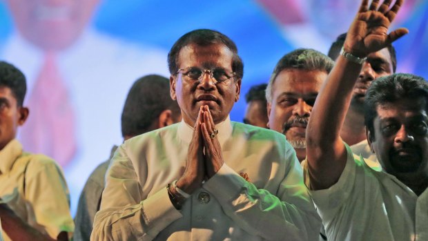 Sri Lanka's opposition presidential candidate, Mithripala Sirisena, greets supporters at his final campaign rally on Monday.