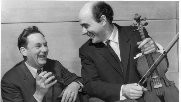 Sharing a joke: Canadian harmonica virtuoso Tommy Reilly and New Zealand violinist Alan Loveday during rehearsal in 1960.