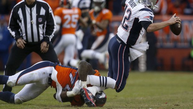 In action: DeMarcus Ware sacks New England quarter back Tom Brady during the AFC Championship game. 