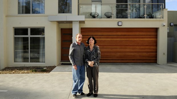 Brian and Lyn Wenn, unhappy at delays getting into their new government-developed townhouse at Garran.