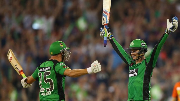Peter Handscomb (right) of the Melbourne Stars celebrates with teammate Scott Boland, after scoring the winning runs and reaching his century against the Perth Scorchers on Wednesday.