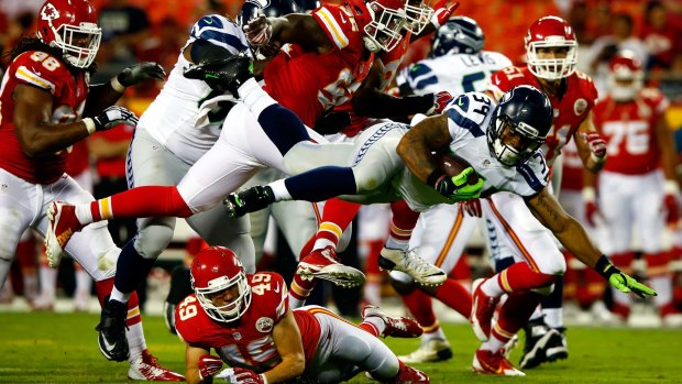 Seahawks runing back Thomas Rawls goes for a first down in the weekend's preseason match against Kansas City.