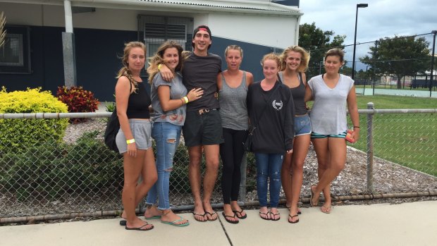 Backpackers prepare for the onset of Cyclone Debbie by meeting at the Bowen evacuation centre.
