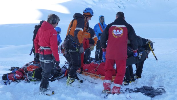 Rescuers prepare to transport the body of an Australian soldier on Aoraki Mount Cook, New Zealand.