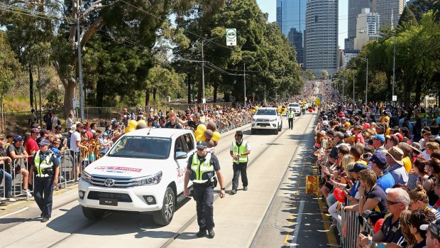 Liam Shiels and Ryan Schoenmakers of the Hawks travel along Wellington Parade during the 2015 AFL grand final parade.
