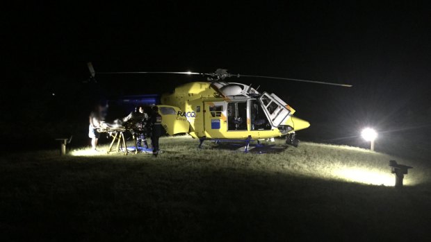 RACQ CareFlight Rescue helps the backpacker on Fraser Island.