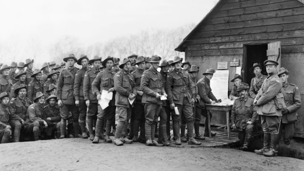 The soldiers' vote: men of the 44th Battalion cast their ballots; conscription referendum, Belgium, December 8, 1917.