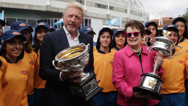 Former champions Boris Becker and Billie Jean King with this year's trophies.