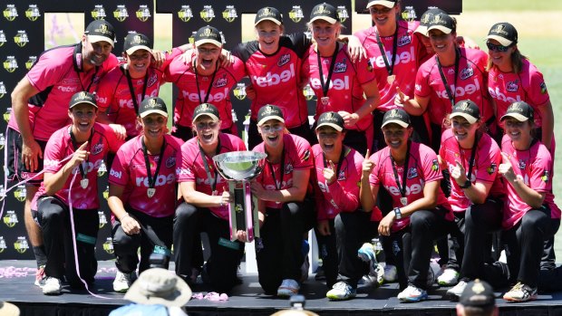 Podium finish: The Sydney Sixers with the WBBL trophy – but the final was played in Adelaide. 