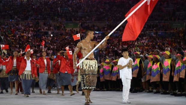 Pita Nikolas Aufatofua of Tonga carries the flag during the Opening Ceremony of the Rio 2016 Olympic Games at Maracana Stadium on August 5, 2016 in Rio de Janeiro, Brazil.  