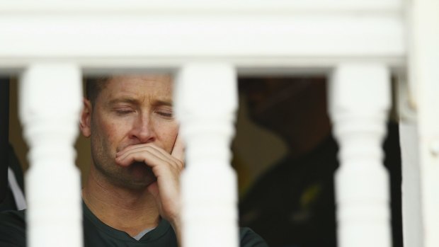Down and out: Michael Clarke in the rooms on day two.