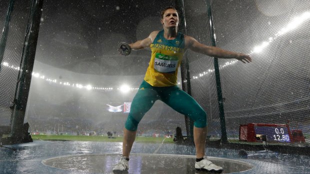 Australia's Dani Samuels throws in torrential conditions at the Rio Games.
