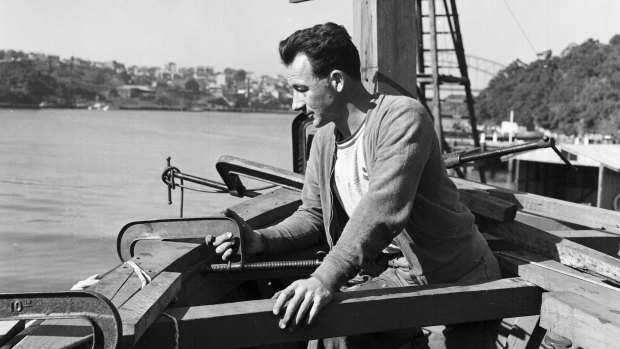 Boat builder Reg Holmes, pictured at Lavender Bay on 20 September 1956, building a boat to take guests crocodile hunting in the Gulf. 