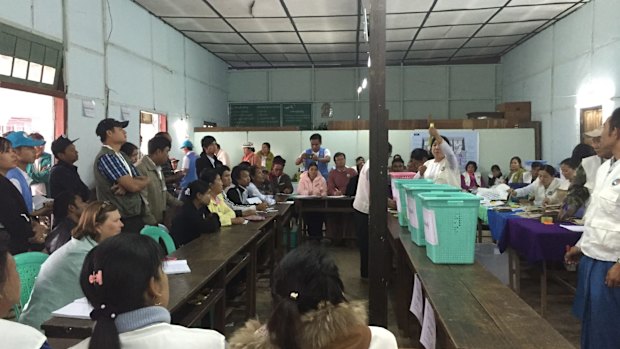 Scrutineer Jane Waddell (left) watches as the count begins in Kalaw, Myanmar.