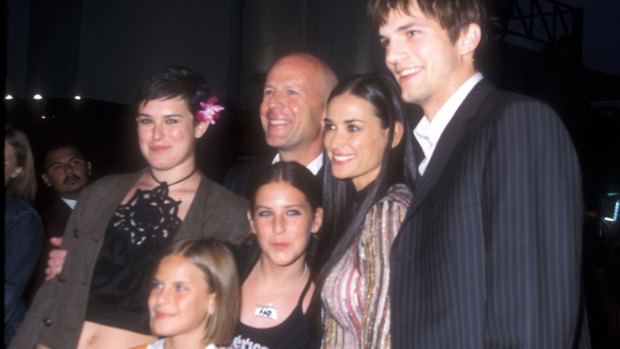 Demi Moore with her three daughters, their dad, Bruce Willis and Moore's former partner, Ashton Kutcher in 2003.