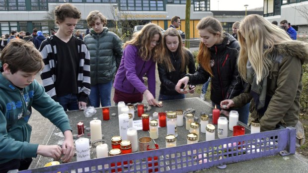 Students light candles at the Joseph-Koenig Gymnasium in Haltern, Germany. Sixteen school children and two teachers from Haltern are among the victims. 