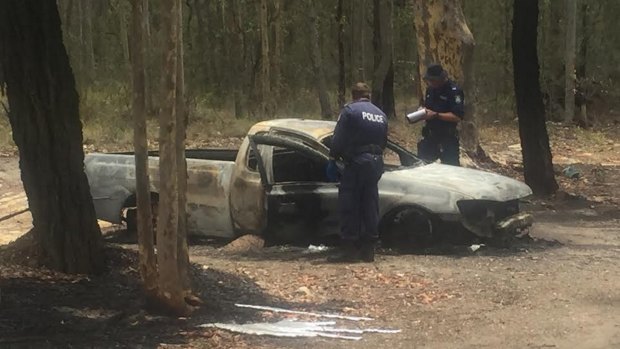 People collecting scrap metal discovered a body in a burnt-out ute on Thursday.