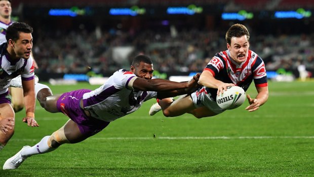 The Roosters' Luke Keary makes a flying dive for the try line.