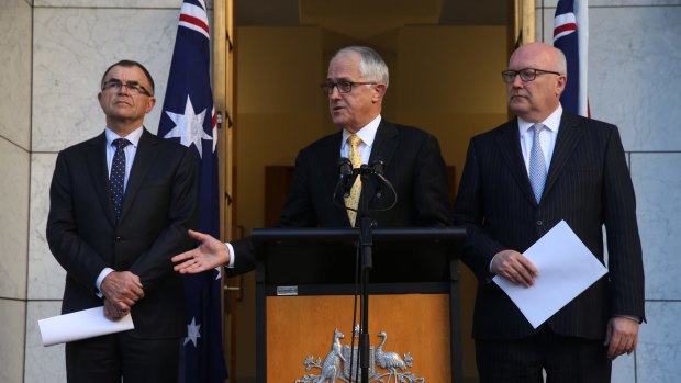 Prime Minister Malcolm Turnbull and Attorney-General George Brandis at last week's announcement naming Brian Martin as the commissioner.