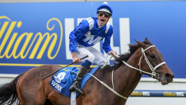 Hall of famer: Hugh Bowman and Winx win a second Cox Plate in October last year.