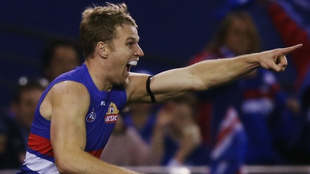 Just look at that: Jake Stringer of the Bulldogs celebrates one of his four goals on Sunday.