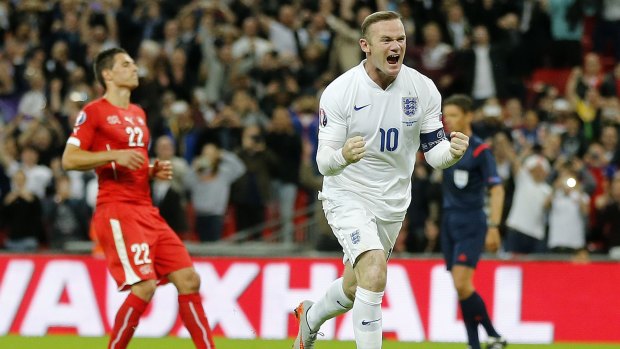 Out in front: Wayne Rooney reaches the milestone against Switzlerand at Wembley.