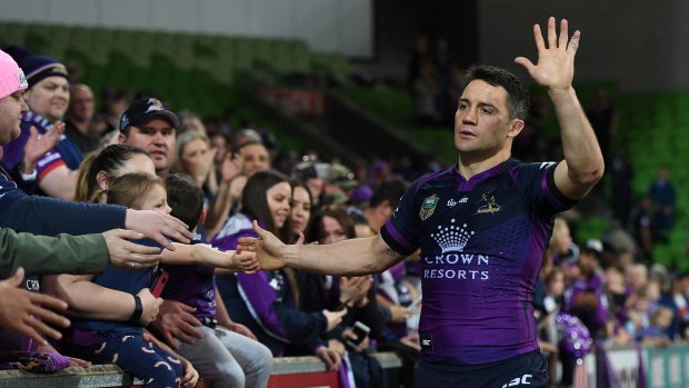 Fond farewell: Cooper Cronk bids farewell to the Melbourne fans following the Storm's preliminary final win over the Broncos.