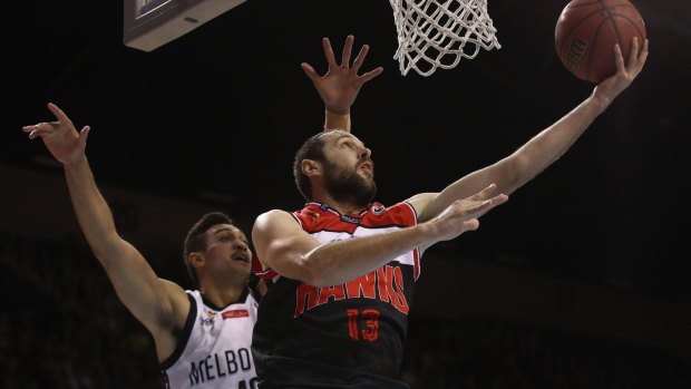 Up and under: Illawarra's Rhys Martin lays up a shot against Melbourne.