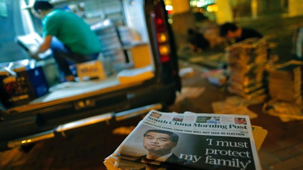 Copies of a local newspaper reporting Leung Chun-ying on the cover are piled up at a Hong Kong distribution point on Saturday.