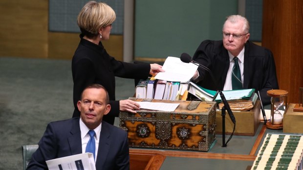 Foreign Affairs Minister Julie Bishop pictured on June 4 tabling a letter after adding to an answer on Man Haron Monis writing to Attorney-General Senator George Brandis.