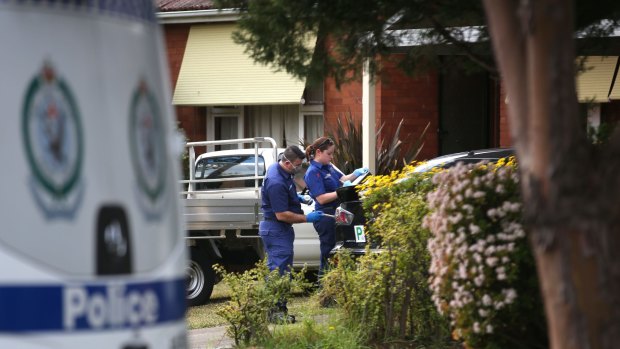 Police comb the scene of the Panania street brawl in June 2016.