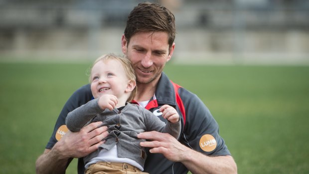 Proud: Western Bulldogs veteran Matthew Boyd with son James. The retiree says life after footy isn't daunting him.  