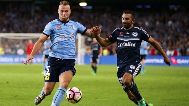 Jordy Buijs of Sydney FC is challenged by Fahid Ben Khalfallah of Melbourne Victory during the 2017 A-League grand final match. Buijs joined the club in the January transfer window. 