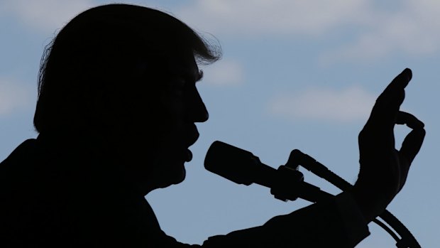 President Donald Trump addresses US troops and their families at the Sigonella Naval Air Station, in Sigonella, Italy, on Saturday.