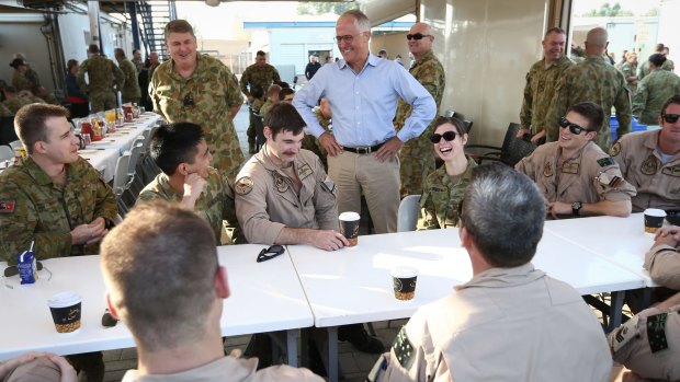 Prime Minister Malcolm Turnbull meets with troops during breakfast at Camp Baird in the Middle East.