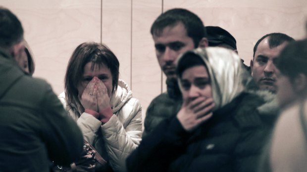 Relatives and the friends of those on the Metrojet flight that crashed in Egypt grieve at a hotel near St Petersburg's airport on Saturday. 