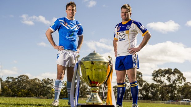 Marc Herbert and Mick Picker with the Canberra Raiders Cup before last year's grand final. 