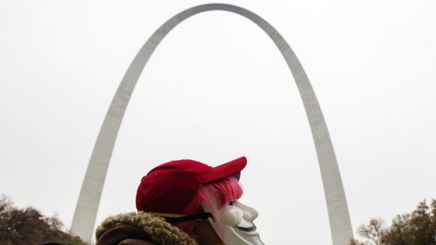 A demonstrator takes part in a 'mock trial' of white policeman Darren Wilson near the Gateway Arch, which was allegedly the target of a bomb plot. Tourists can take a carriage up to an observation deck at the top of the monument.