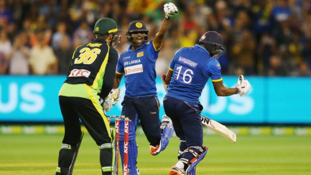 Big win: Seekkuge Prasanna of Sri Lanka reacts after Chamara Kapugedera hits the winning runs.