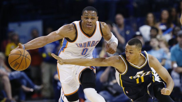 A lot to learn: Young Australian guard Dante Exum tries to steal the ball back for Utah against Oklahoma City's Russell Westbrook.