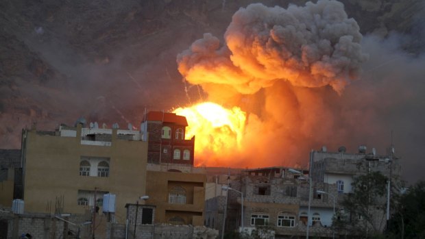 Fire and smoke billows from an army weapons depot after it was hit by an air strike in Yemen's capital Sanaa on Monday. 