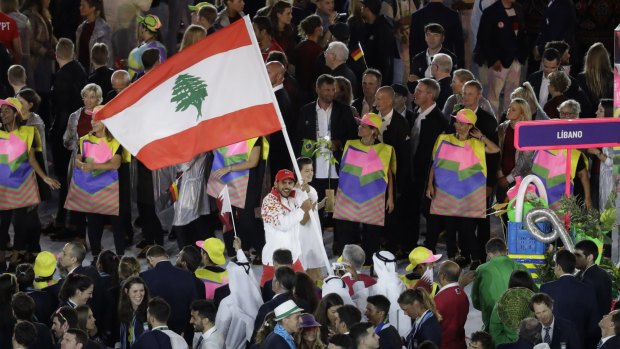 Nacif Elias carries the Lebanese flag during the opening ceremony of the Rio Olympics. 