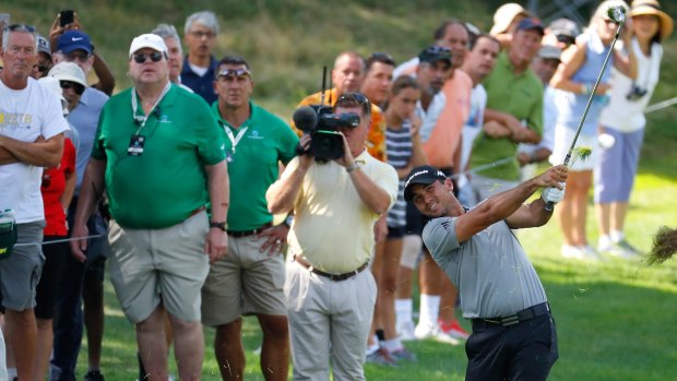 Jason Day plays his second shot on the second hole during the first round of The Barclays.