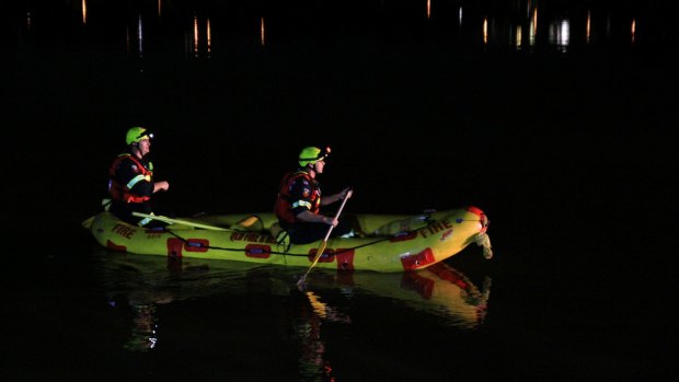 Swift water rescue teams scour the Brisbane River searching for missing man on Saturday night.