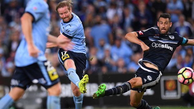 Pressure player: David Carney shoots for goal in the A-League grand final against Melbourne Victory in May.