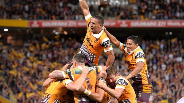 Big win: Justin Hodges and the Broncos celebrate a try by centre Jack Reed against the Roosters at Suncorp Stadium.